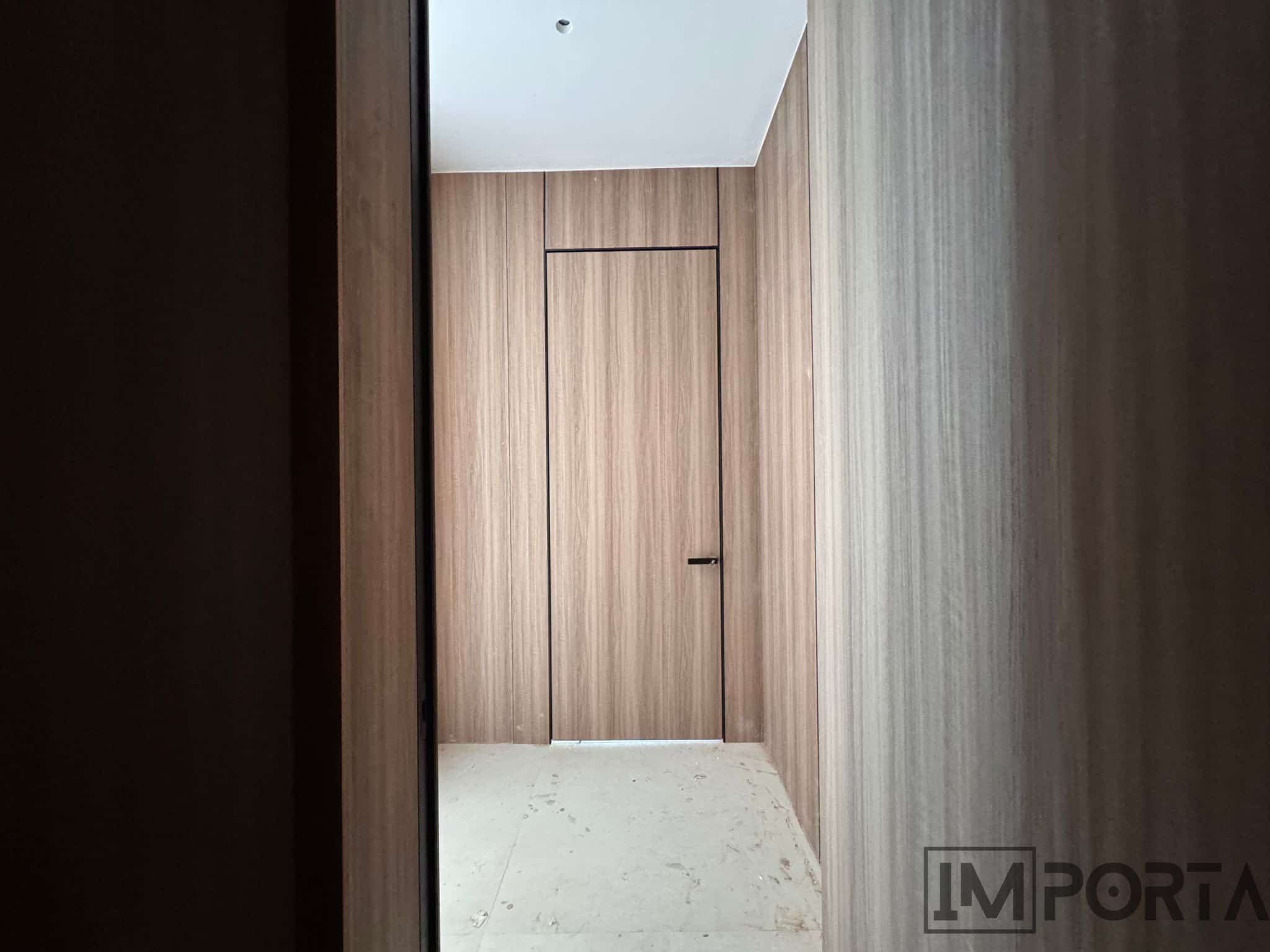 Veneer Hidden Doors with Royal Black Profiles
