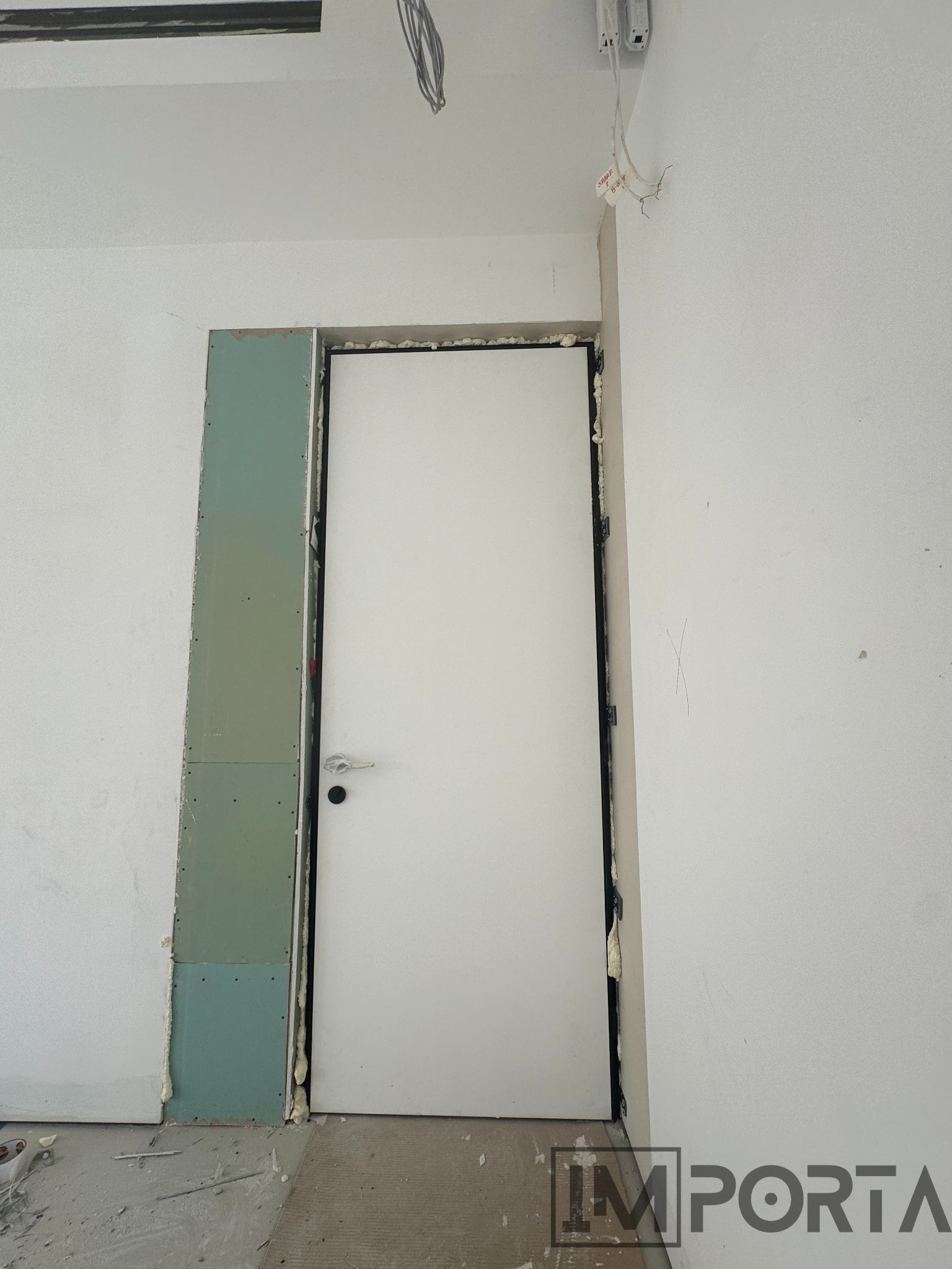 flush-white-door-black-frame-modern-interior.jpg