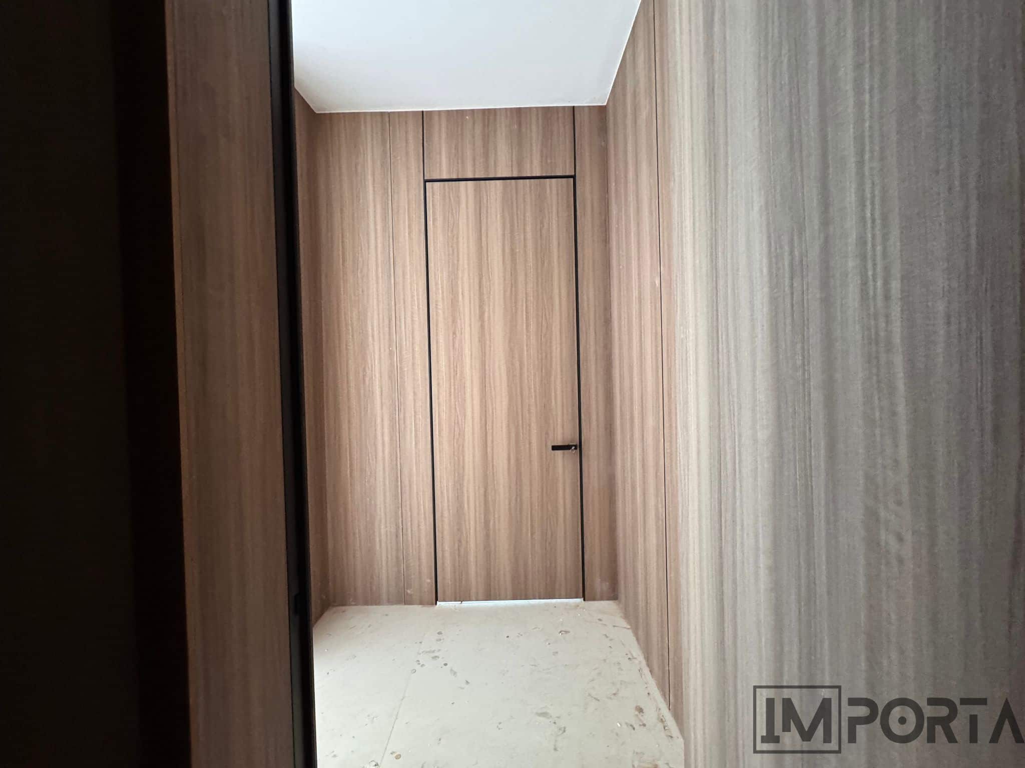 natural-wood-veneer-flush-door-black-trim.jpg