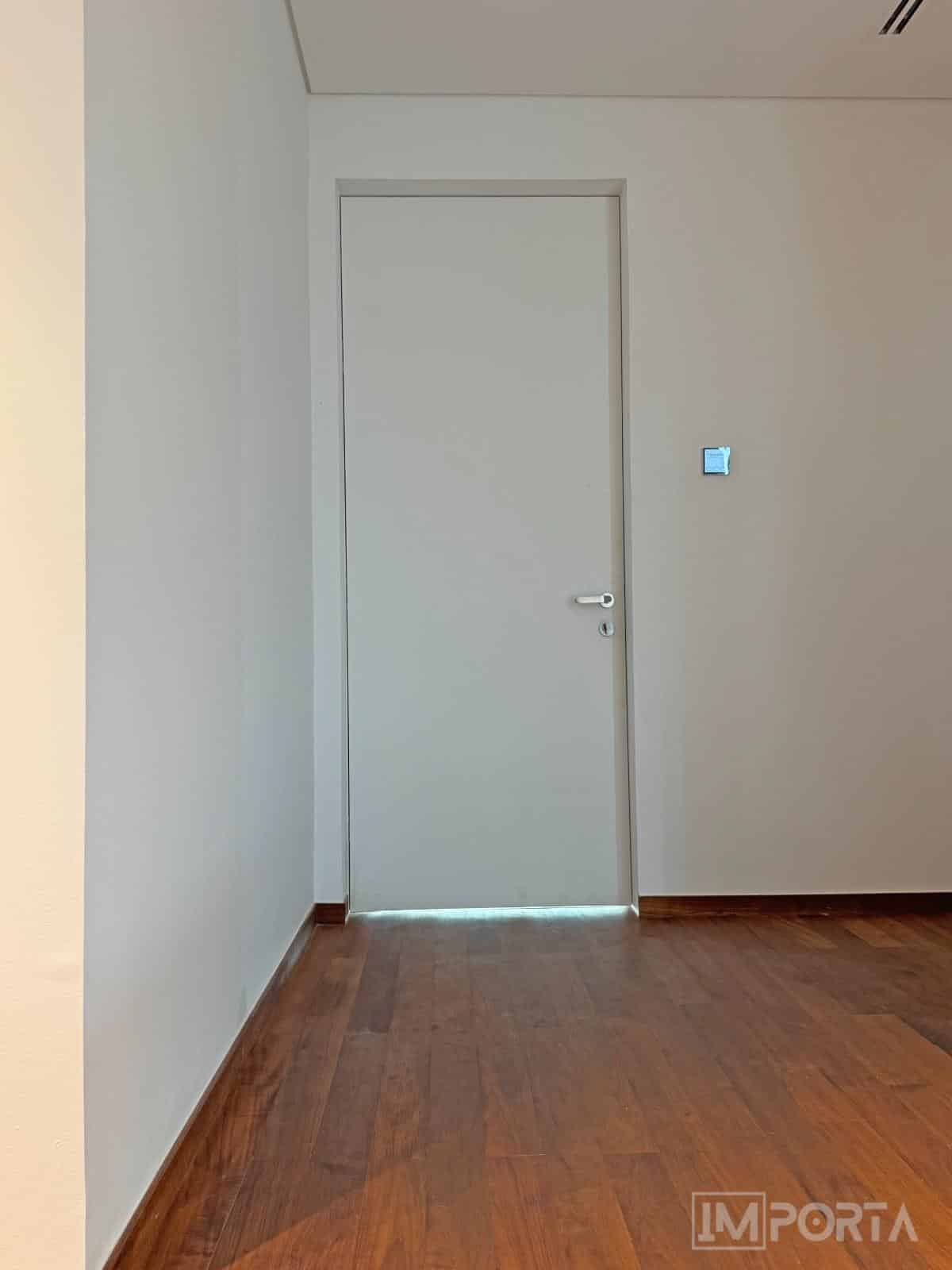 white-interior-door-flush-with-wall-modern-home