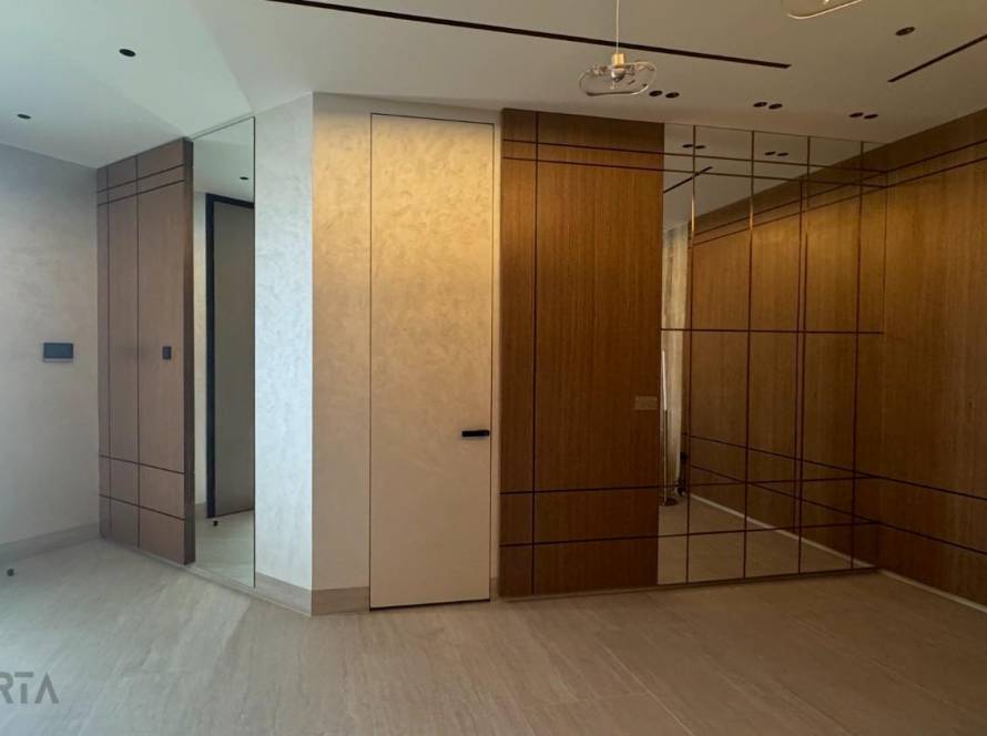 travertini minimalsit concealed door plaster finish