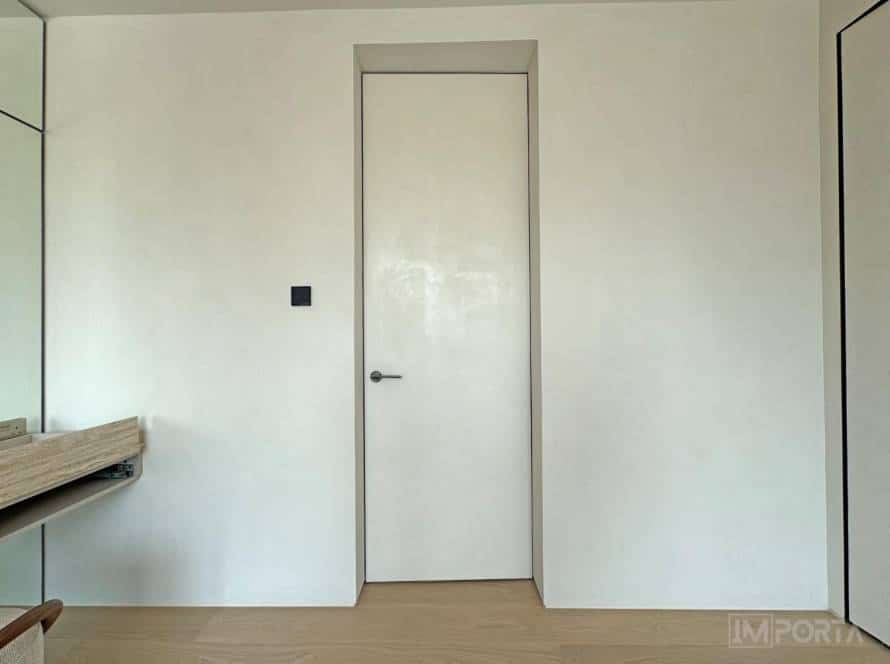 travertini minimalist white concealed door dubai interior