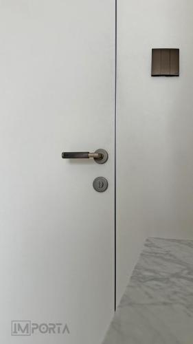 White_PUpainted_concealed_doors_for_apartment_Importa