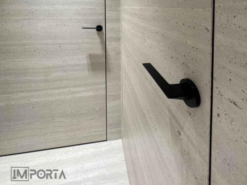 concealed door system full wall tile integration view