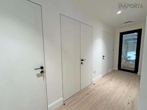 double leaf concealed door system for modern home