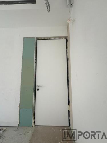flush-white-door-black-frame-modern-interior.jpg