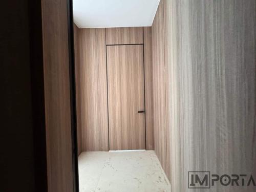 natural-wood-veneer-flush-door-black-trim.jpg