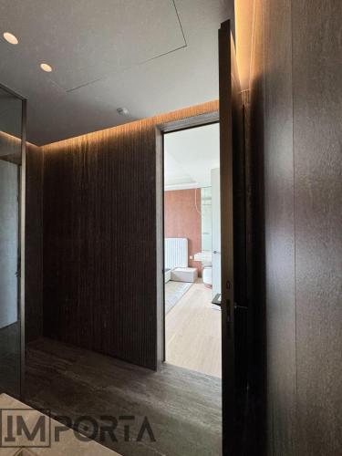 textured-hidden-door-gold-trim-importa.jpg