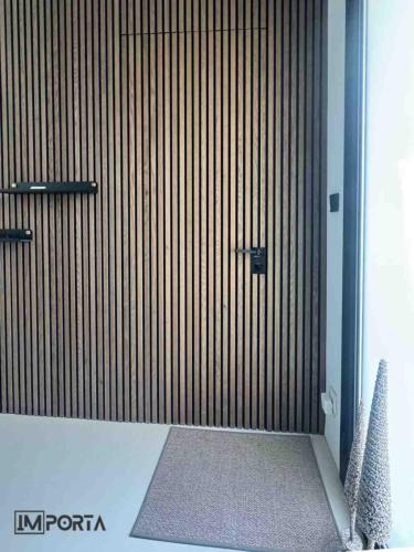 travertini acoustic slat wall concealed door uae
