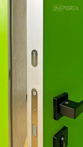 travertini green filomuro concealed door silver frame